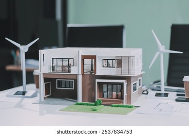 Engineers meeting about wind turbine model and house model. Renewable energy and housing development concept. Team of architects and engineers in modern office discussing design structure. - Powered by Shutterstock