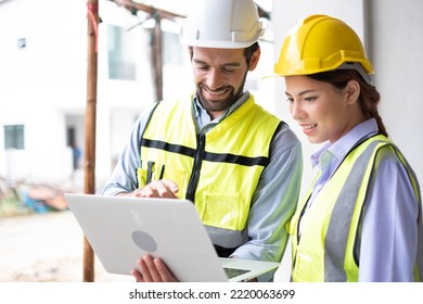 Engineers on building site. Engineer are working contruction on site plans to build high-rise buildings building. Architect caucasian man working with colleagues mixed race in the construction site.