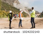 Engineers on construction site. Industrial blasting at a construction site