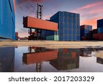 Engineers are overseeing the transportation of cargo with containers inside the warehouse. Container in export and import business and logistics.