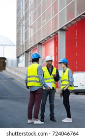 Engineers Standing Outside Factory