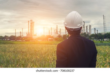 Engineers standing at the refinery. The concept of energy crisis