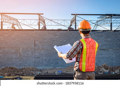 Engineers are supervising the construction work at the site. - Shutterstock ID 1837958116