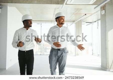 engineers team are discussing while inspecting at construction site.