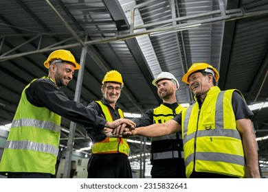 Engineers and technicians and workers, working together as a team, are joining forces to work on a grand project, industrial warehouse warehouse backdrop.