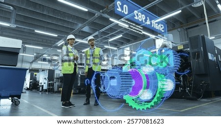 Engineers Use Augmented Reality to Visualize 3D Engine Turbine Concept in Factory Setting. Holographic Display Shows VFX Mechanical Components, Design and Analysis Processes for Industrial Innovation.