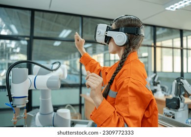 Engineers are using virtual AR to maintain and check the work of human robot in the 4.0 smart factory,Industrial robot programming software for automated manufacturing technology.