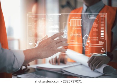 Engineers using VR technology reading holographic screens showing various piping and control systems within the plant,Factory Engineers are inspecting manufacturing processes.
