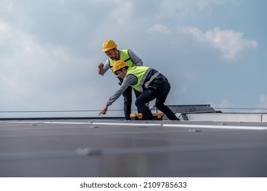 Engineers Walking On Roof Inspect And Check Solar Cell Panel By Hold Equipment Box And Radio Communication ,solar Cell Is Smart Grid Ecology Energy Sunlight Alternative Power Factory Concept.