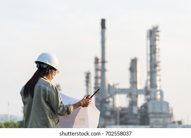 Engineers Woman Holding Radio, Blueprint And Report Schedule For Workers Security Control At Power Plant Energy Industry, Engineer Concept,professional,safety,industry
