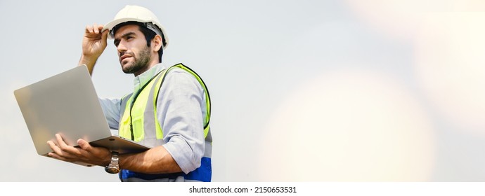 Engineers Working On Railway Train Statation And Holding Laptop For Plan And Meeting. Portrait Of Professional Leadership Of Engineering. Warehouse And Successful Concept. 