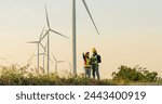 Engineers are working with wind turbines, Green ecological power energy generation, and sustainable windmill field farms. Alternative renewable energy for clean energy concept.