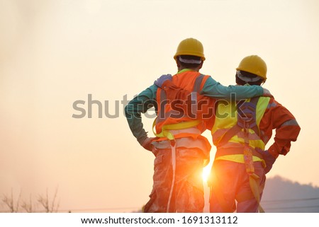 Engineers in yellow helmet and the best greetings with the warm handshake team Visit the website Modern construction and engineering concepts Safety at work in production and construction sites