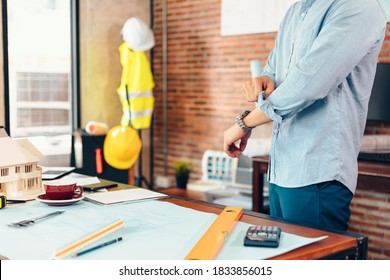 Enginner Roll Up The Sleeves Before Working At Workplace.