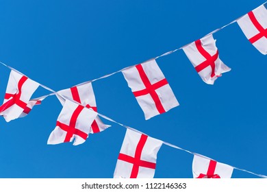 England Flags / Bunting Against Blue Sky.