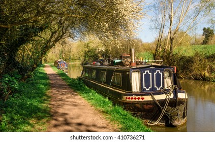 England - Inland Navigation. Barge moored on a stretch of the Grand Union Canal near Leamington Spa, in Warwickshire, England, United Kingdom. - Powered by Shutterstock