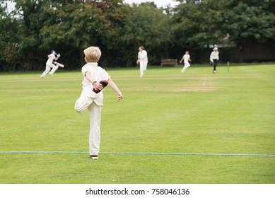 England School Youth Player Warming Up For Village Cricket Game In The UK In Summer
