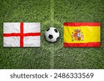 England vs. Spain flags on green soccer field or football field