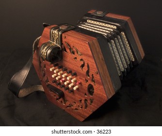 English 48-key Lachenal Concertina On Black Background