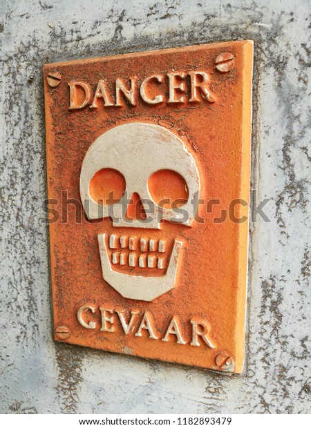 english-afrikaans-danger-sign-stock-photo-1182893479-shutterstock