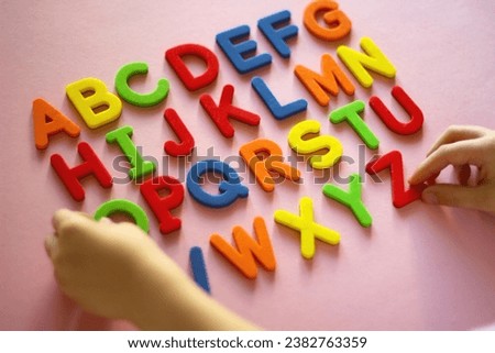 english alphabet. kid playing alphabet letters. Intellectual game, preschool primary education, early development