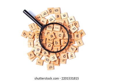 English alphabet made of square wooden tiles with the English alphabet scattered on white background. The concept of thinking development, grammar
