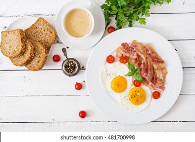 English Breakfast - Fried Egg,  Tomatoes And Bacon. Top View