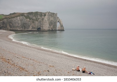 English Channel, France, Etretat, October 30, 2013. An Elderly Couple Relax After Swimming On The Beach.