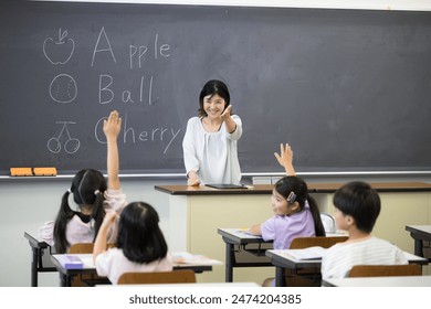 English class in a Japanese elementary school classroom Teacher and children	 - Powered by Shutterstock