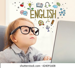 English concept with toddler girl using her laptop
