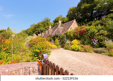 English Country Cottage In The Sunshine In Cotswolds, England, UK