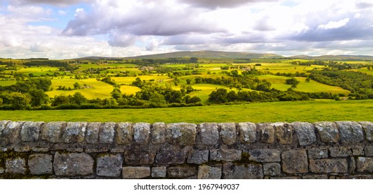 English Countryside And Farmland Landscape Panorama Background Along Hadrian's Wall Roman Ruin. Beautiful Rural Country Side Pastures In England