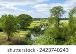 English countryside with river, trees and fields. Stony Stratford Nature Reserve, Milton Keynes, UK