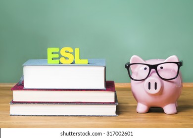 English As A Foreign Language ESL Theme With Pink Piggy Bank With Chalkboard In The Background As Concept Image Of The Costs Of Education