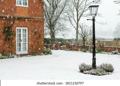 English Garden Of A Country House In Winter Snow, UK