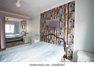 English Interior Design On A Family Bedroom With A Feature Wall.