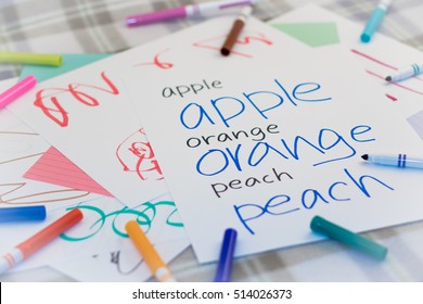 English; Kids Writing Name Of The Fruits For Practice