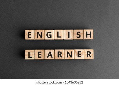 English Learner - Phrase From Wooden Blocks With Letters, Student  English Learner Concept, Top View Gray Background