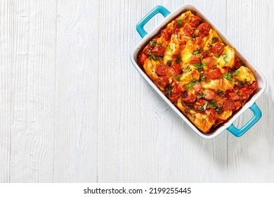 English Muffin Sausage Egg Bake In Baking Dish On White Wooden Table, Horizontal View From Above, Flat Lay, Free Space