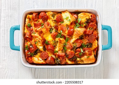 English Muffin Sausage Egg Bake In Baking Dish On White Wooden Table, Flat Lay, Close-up