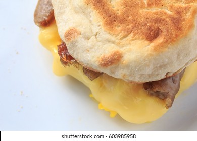 English Muffin, Sausage, Egg And Cheese Breakfast Sandwich.