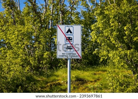 English and norwegian sign "No camping - Camping forbudt" to avoid wildcamping in the nature at Lofoten islands in Norway