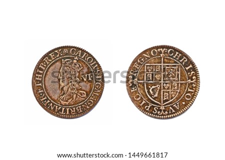 An English pre-decimal sixpence dating from around 1631 with the bust of King Charles I on the obverse and isolated on a white background.