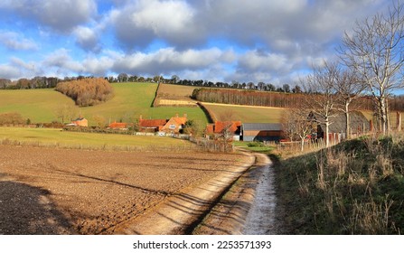 An English Rural Landscape in the Chiltern Hills with farm and Hamlet in the valley in Winter sunshine - Shutterstock ID 2253571393