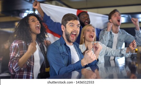 English soccer supporters with flag celebrating victory of national team, derby - Powered by Shutterstock