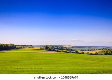 English Summer Rural Landscape With Rolling Green And Yellow Fields In Southern England, UK