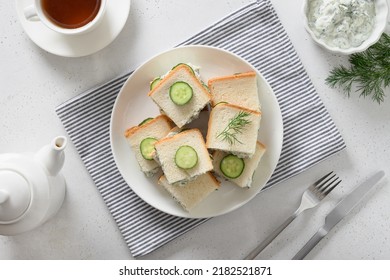 English Tea And Cucumber Sandwiches On White Background. Crispy Freshness Cold British Summer Appetizer. View From Above.