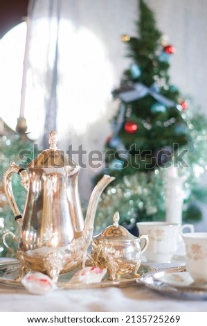 English tea party, silver tea set against the background of the Christmas 