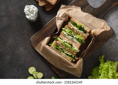 English Tea Sandwiches With Cream Cheese, Dill, Cucumber On Brown Background. Cold Traditional Tasty Appetizer. View From Above. Copy Space.