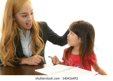 English Teacher With Girl Studying.